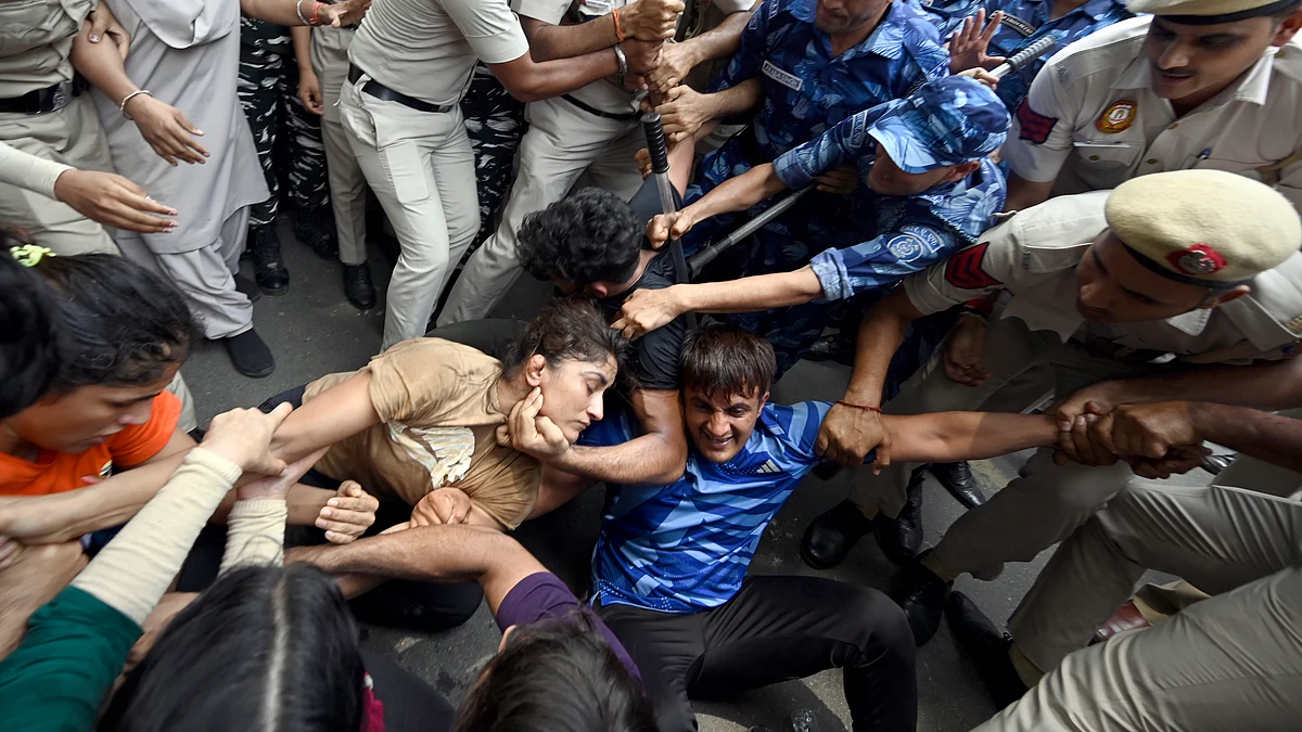 The Delhi police scuffled with the wrestlers as they attempted to march towards the new Parliament building, on May 28, 2023 in New Delhi, India. (Photo by Sanjeev Verma/Hindustan Times via Getty Images)