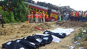 Bodies pulled from the wreckage of the Bengaluru–Howrah superfast express and the Coromandel Express set aside in bags at the accident site near Bahanaga Bazar station in Balasore district of Odisha (photo: Biswanath Swain/IANS)