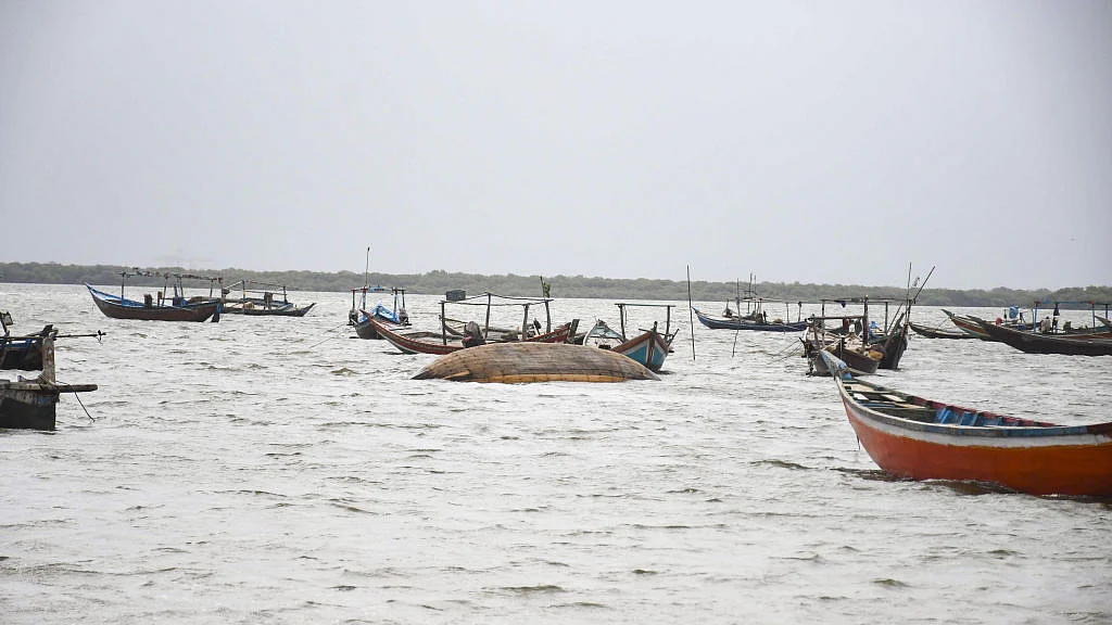 Boats are seen as Pakistani flood victims trying to cross sea water due to Cyclone Biparjoy approaching to the coastal area in Karachi, Pakistan on June 14, 2023. (all photos: Sabir Mazhar/Anadolu Agency via Getty Images)