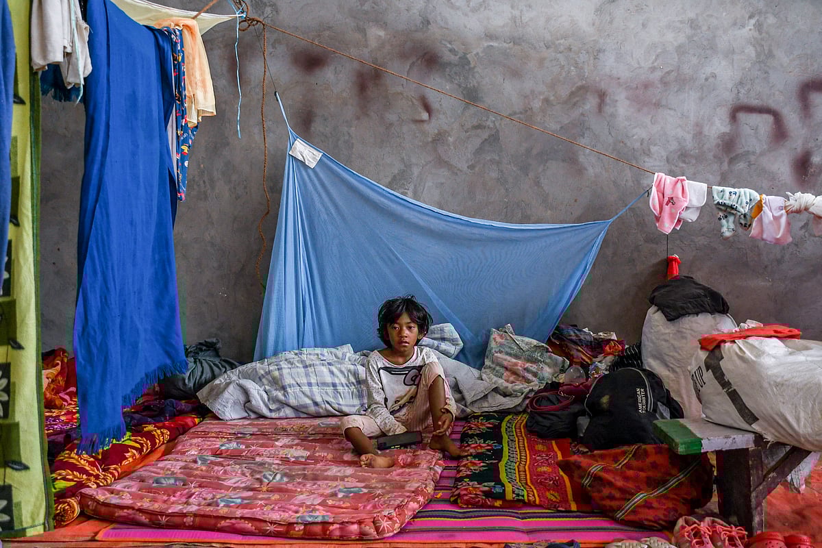 Churachandpur, Manipur: A young girl reacts to the camera at a makeshift relief camp in Saidan village (photo: Getty Images)