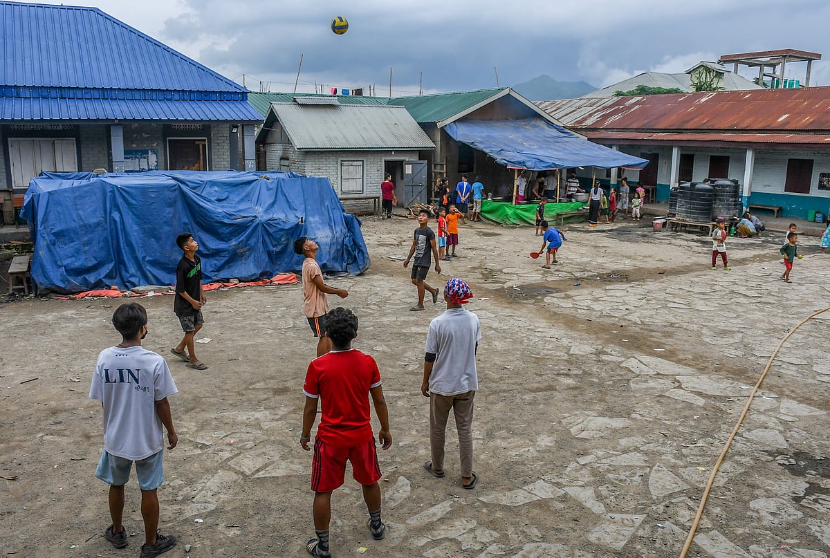 Churachandpur, Manipur: Children play outside a makeshift relief camp at Rengkia village (photo: Getty Images)