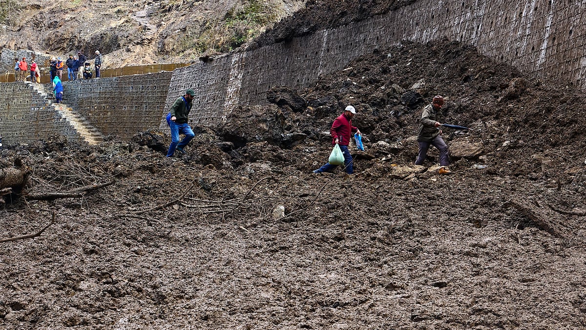 Representative image of a landslide; People are walking by foot over the closed highway which was hit by a mudslide in Ramban District, Jammu and Kashmir, India on January 31, 2023. (photo: Getty Images)