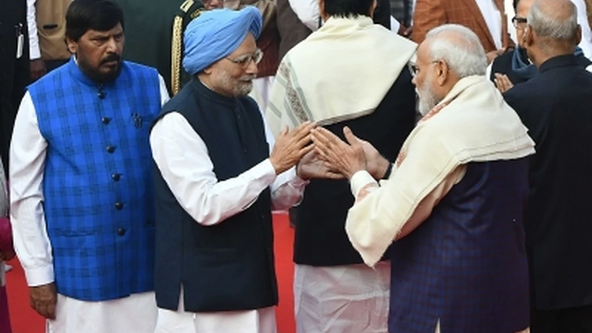File photograph of PM Modi and Manmohan Singh greeting each other (Photo: IANS)