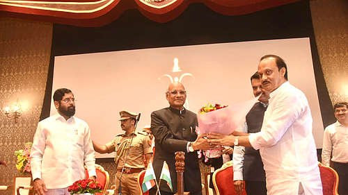 Ajit Pawar with Eknath Shinde and Devendra Fadnavis at the Raj Bhavan on Sunday, 2 July