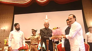 Ajit Pawar with Eknath Shinde and Devendra Fadnavis at the Raj Bhavan on Sunday, 2 July