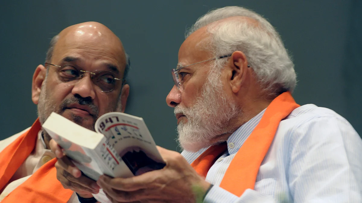 Prime Minister Narendra Modi with Home Minister and president of the  Bhartiya Janata Party Amit Shah (Photo: Getty Images)