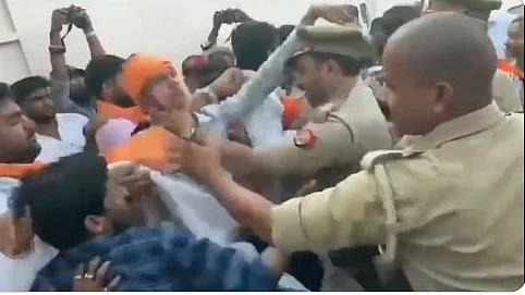 In this video grab, ABVP goons can be seen attacking police officers as the latter tried to shield Gorakhpur varsity VC, 21 July 2023