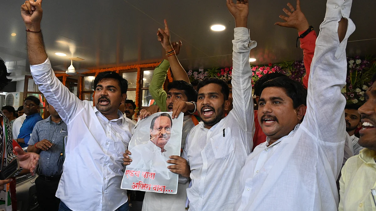 Maharashtra's new deputy CM Ajit Pawar's supporters during the inauguration of the new party office near Mantralaya in Mumbai, Maharashtra, on 4 July (photo: Getty Images)
