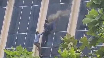 People jumping off the buidling (Photo: IANS)