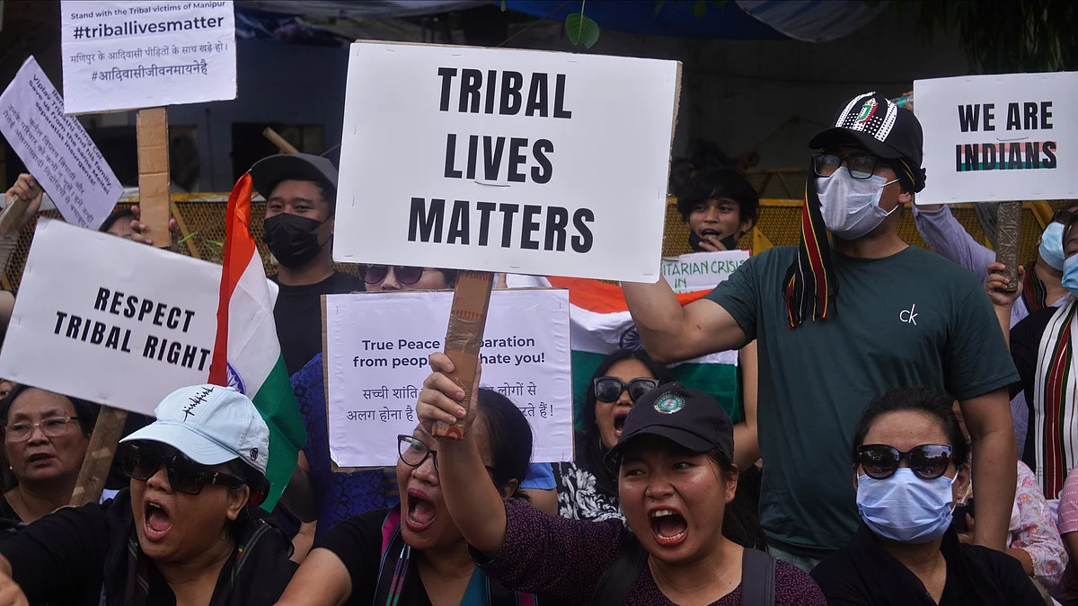 Members of the Kuki and Zo tribes hold Indian flags and placards during a protest amid ongoing ethnic violence in India's northeastern Manipur (Photo: Getty Images)