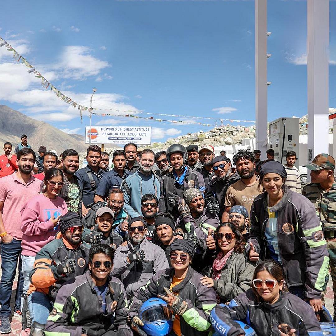 Rahul Gandhi with fellow bikers and locals in front of a Bharat Petroleum outlet, which holds the record for being the world's highest altitude petrol station-at 12,933 feet (photo: Indian National Congress)