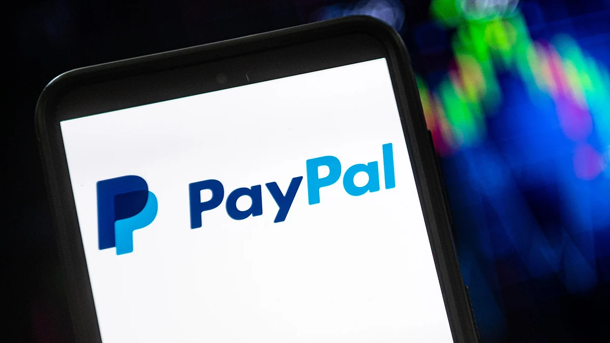 In this photo illustration a PayPal logo seen displayed on a smartphone (Photo: Getty Images)