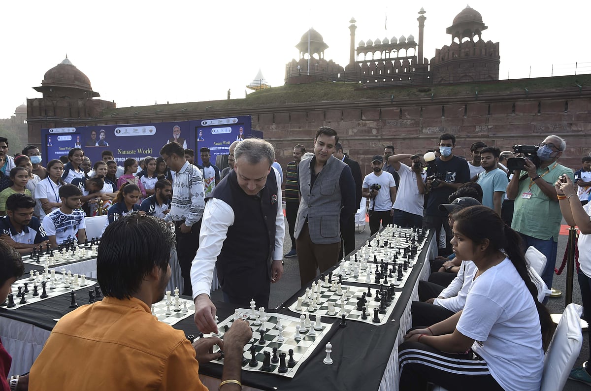 In this image from 2022, FIDE president Arkady Dvorkovich plays with youngsters at a ceremony to mark the start of the torch relay for the 44th Chess Olympiad, at Delhi's Red Fort (photo: Getty Images)