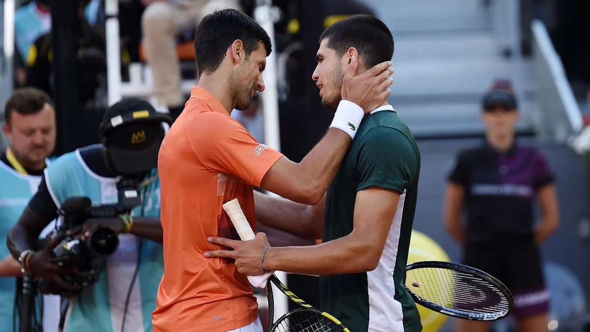 Novak Djokovic (left) of Serbia and Carlos Alcaraz of Spain after their Men's Singles Semi-finals match during day ten of Mutua Madrid Open at La Caja Magica on May 07, 2022 in Madrid, Spain. (Photo: Denis Doyle/Getty Images)