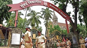 Mumbai police stationed outside the Mumbai University campus, 18 August (Photo: Getty Images)