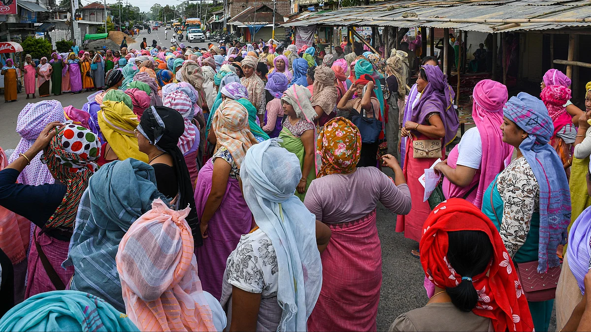 Women from the women's activist group Meira Paibi (which literally means women torch bearers) blocked several roads in Imphal, Bishnupur and Thoubal districts (Photo by Biplov Bhuyan/SOPA Images/LightRocket via Getty Images)