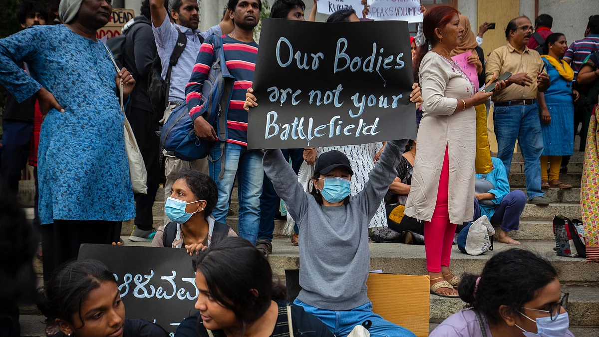 Demonstrators in Bengaluru hold up placards, with slogans like "Our Bodies are not your Battlefield" during a protest against violence against women in the North-East Indian state of Manipur (photo: Abhishek Chinnappa/Getty Images)