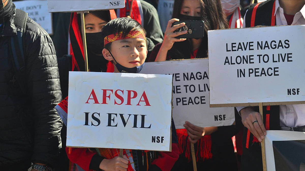 A Naga kid with placard attend a mass rally to repeal Armed Forces Special Power Act (AFPSA) 1958 after  killing of villager by Indian Armed forces in Kohima, on Friday, 17 December 2021.  (Photo: Caisii Mao/NurPhoto via Getty Images)