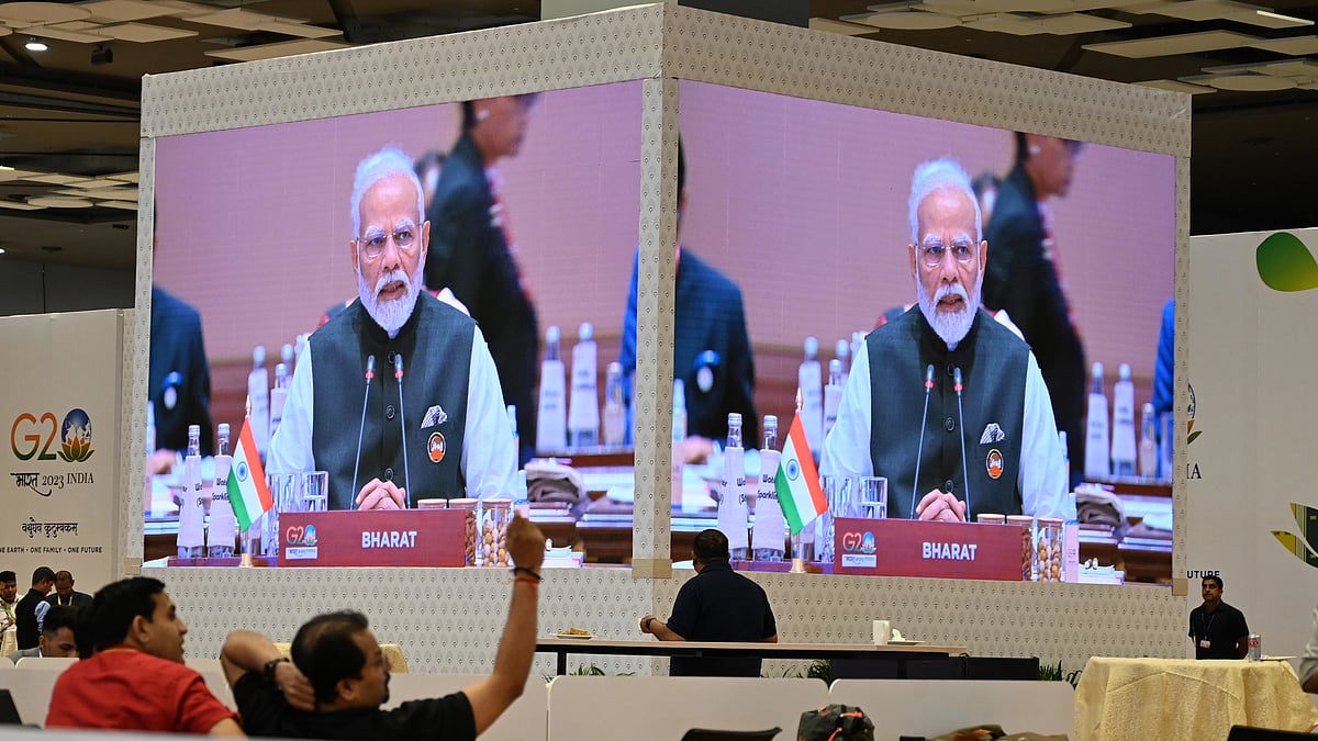 Media personnel at the International Media Centre watch the live telecast of Prime Minister Narendra Modi's speech at the G20 Summit on 9 September 2023 in New Delhi (photo: Sonu Mehta/Hindustan Times via Getty Images)