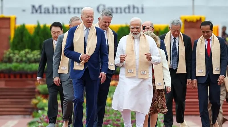 PM Narendra Modi walks alongside US President Joe Biden at Raj Ghat [Photo: @sheela2010/X (formerly Twitter)]