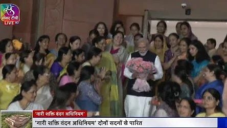 In a choreographed event at parliament house, BJP women MPs present bouquets to PM Modi after Rajya Sabha passes the women quota bill, 21 Sept 2023