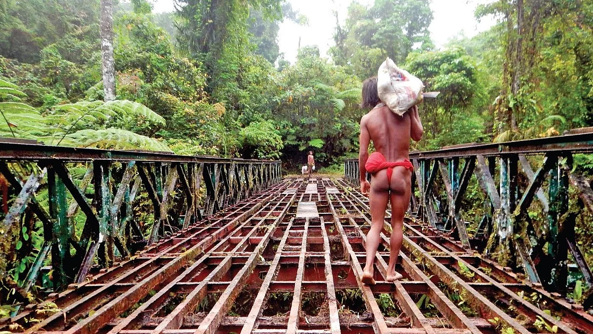 A Shompen tribal returns to his forest home after collecting government rations (Photo: Manish Chandi)