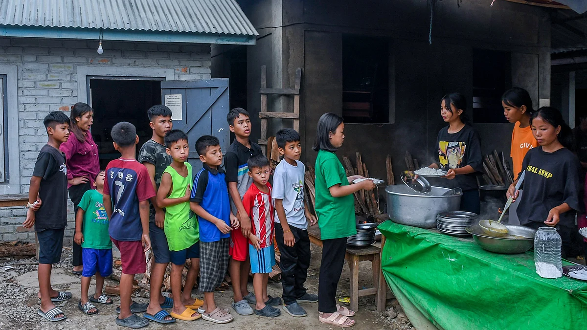 File photo of children waiting to receive food in a Manipur relief camp (photo: Getty Images)