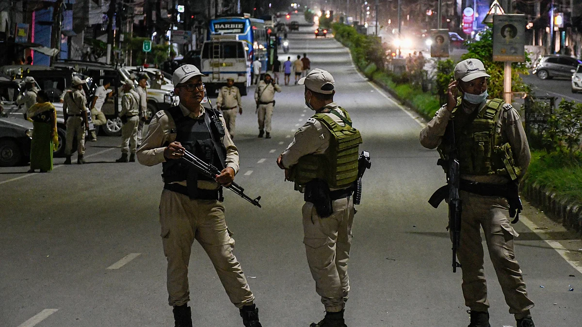 Security forces stand guard at a road blockade in Manipur, where AFSPA has been extended for six months beginning 1 October, 2023 (photo: Getty Images)