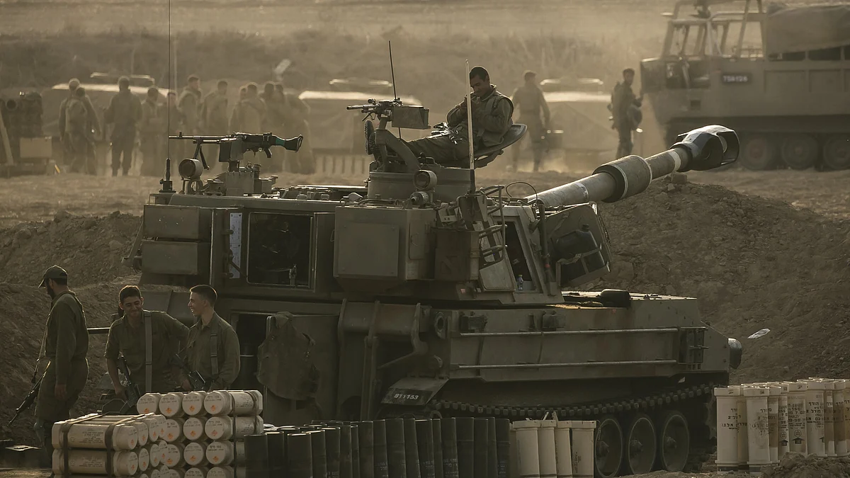 Soldiers sit on an artillery unity near the Israeli border with the Gaza Strip (Photo: Amir Levy/Getty Images)