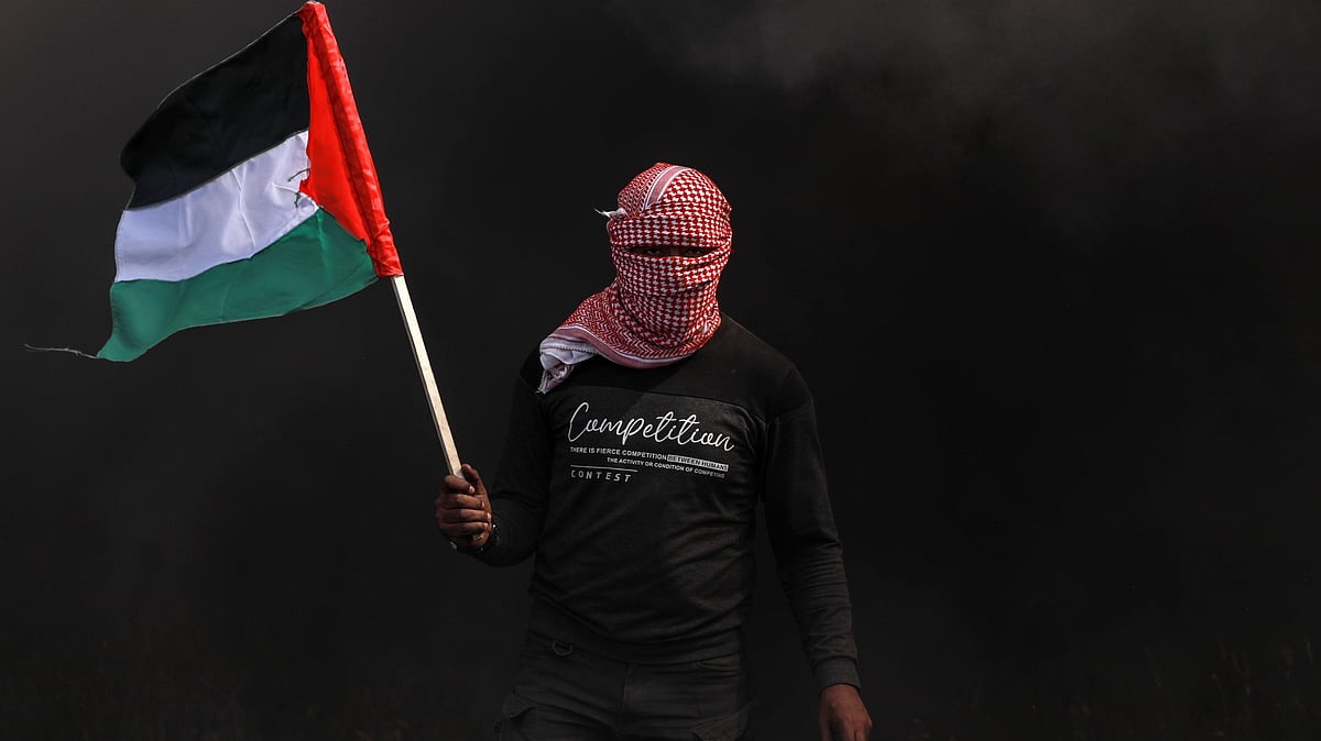 Waving Palestine flag in UK not legitimate during current conflict, warns UK home secretary