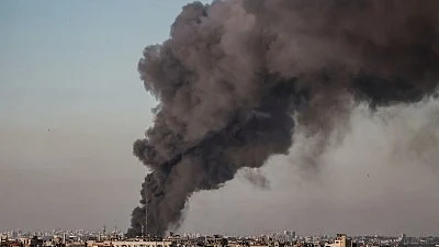 A cloud of dark smoke rises from bombardment near the Gaza border (photo: IANS)