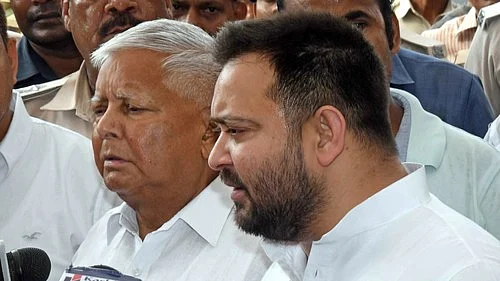 RJD leaders Tejaswi Yadav and Lalu Yadav speaking to media (photo: IANS)