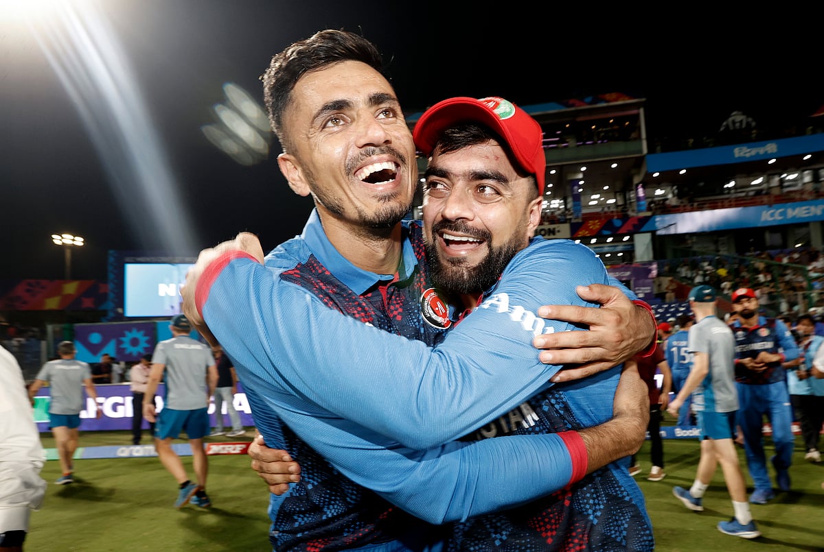 Mujeeb Ur Rahman (left) and Rashid Khan of Afghanistan celebrate their win over England in Delhi (photo: Getty Images)