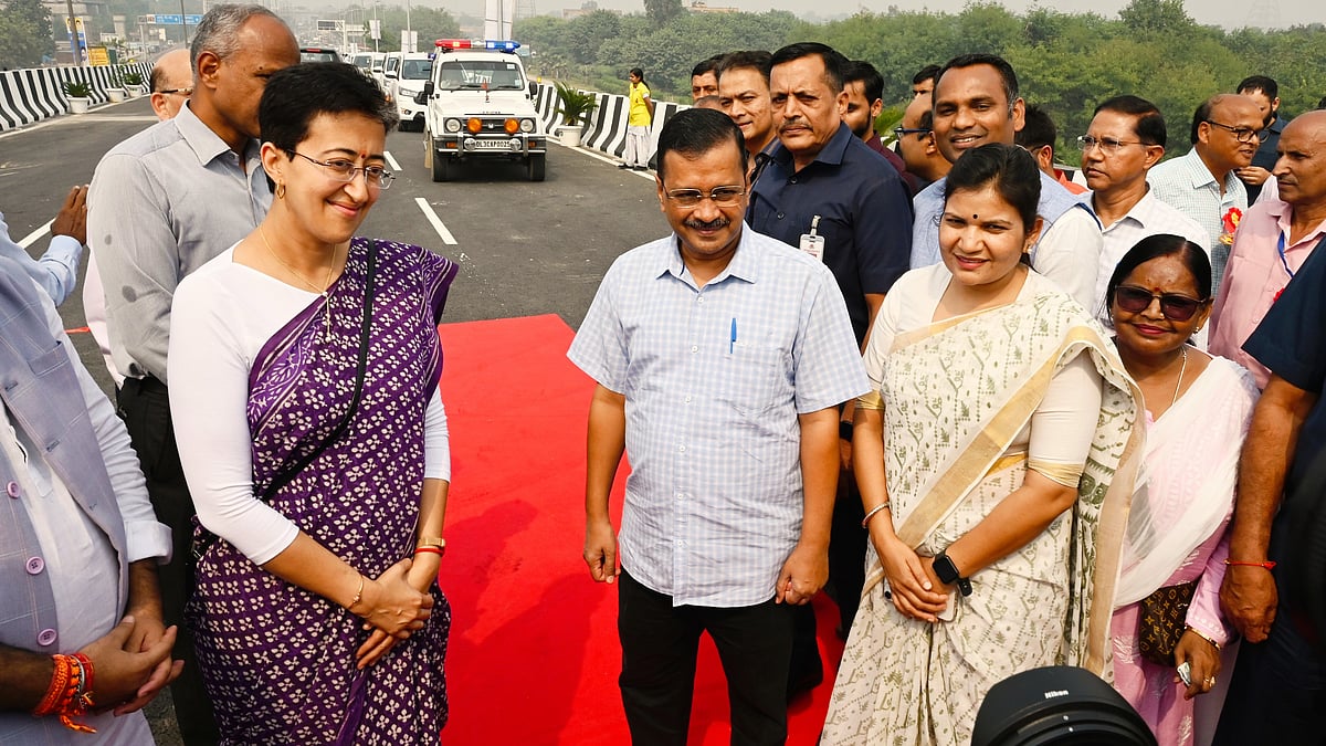 Delhi chief minister Arvind Kejriwal and PWD minister Atishi (left) at the recent inauguration of a flyover in New Delhi (photo: Getty Images)