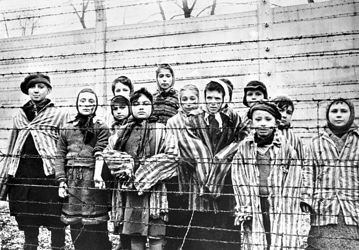 Jewish children at the Nazi concentration camp of Auschwitz-Birkenau in Poland on the day the camp was freed by Russia's Red Army, 27 Jan 1945. Photo by Captain Alexander Vorontsov (Getty Images)