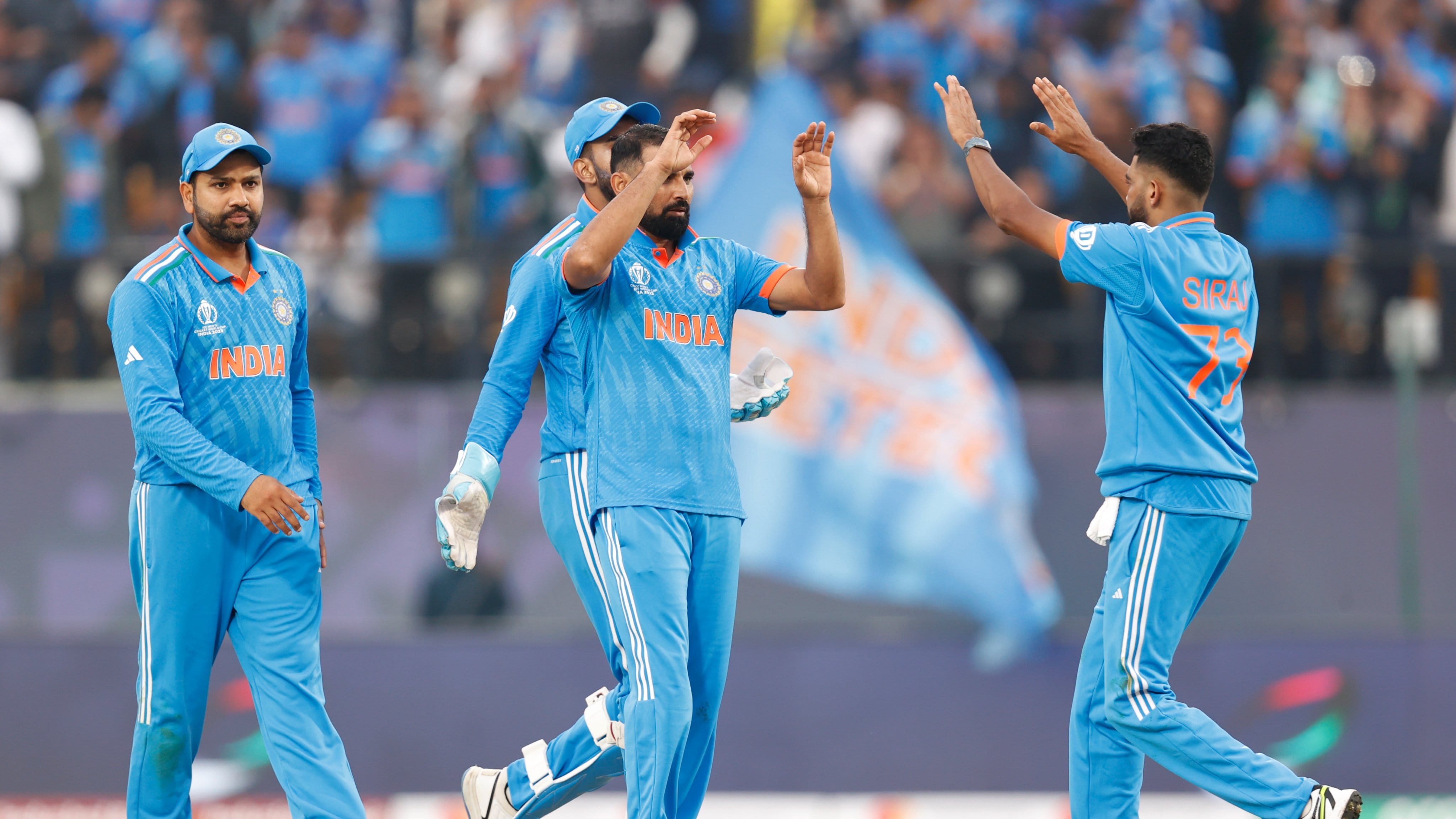 Mohammed Shami celebrates a wicket with teammates in Ind v Nz ODI n Dharamsala, 22 Oct.