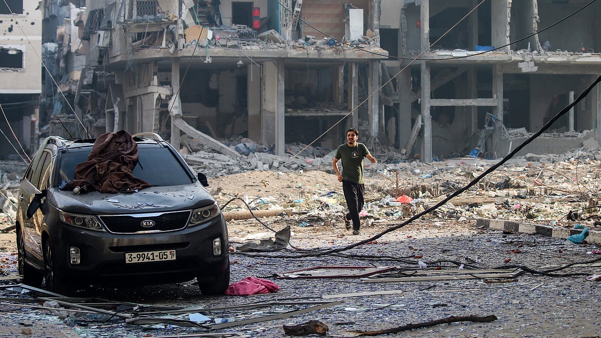 Palestinians inspect damage to their homes caused by Israeli airstrikes in the Karama area of northern Gaza Strip (photo: Getty Images)