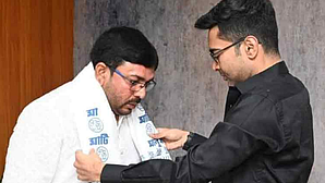Harakali Protihar (left), MLA from Katulpur, switched to TMC in a ceremony attended by general secretary Abhishek Banerjee. (photo: IANS)