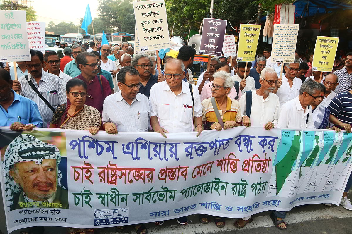 'Stop bloodshed in West Asia. We want peace per the UN resolution. We want a free, sovereign state of Palestine,' reads a banner by All Bengal Minority Youth Federation in Kolkata on 12 October (photo: Getty Images)