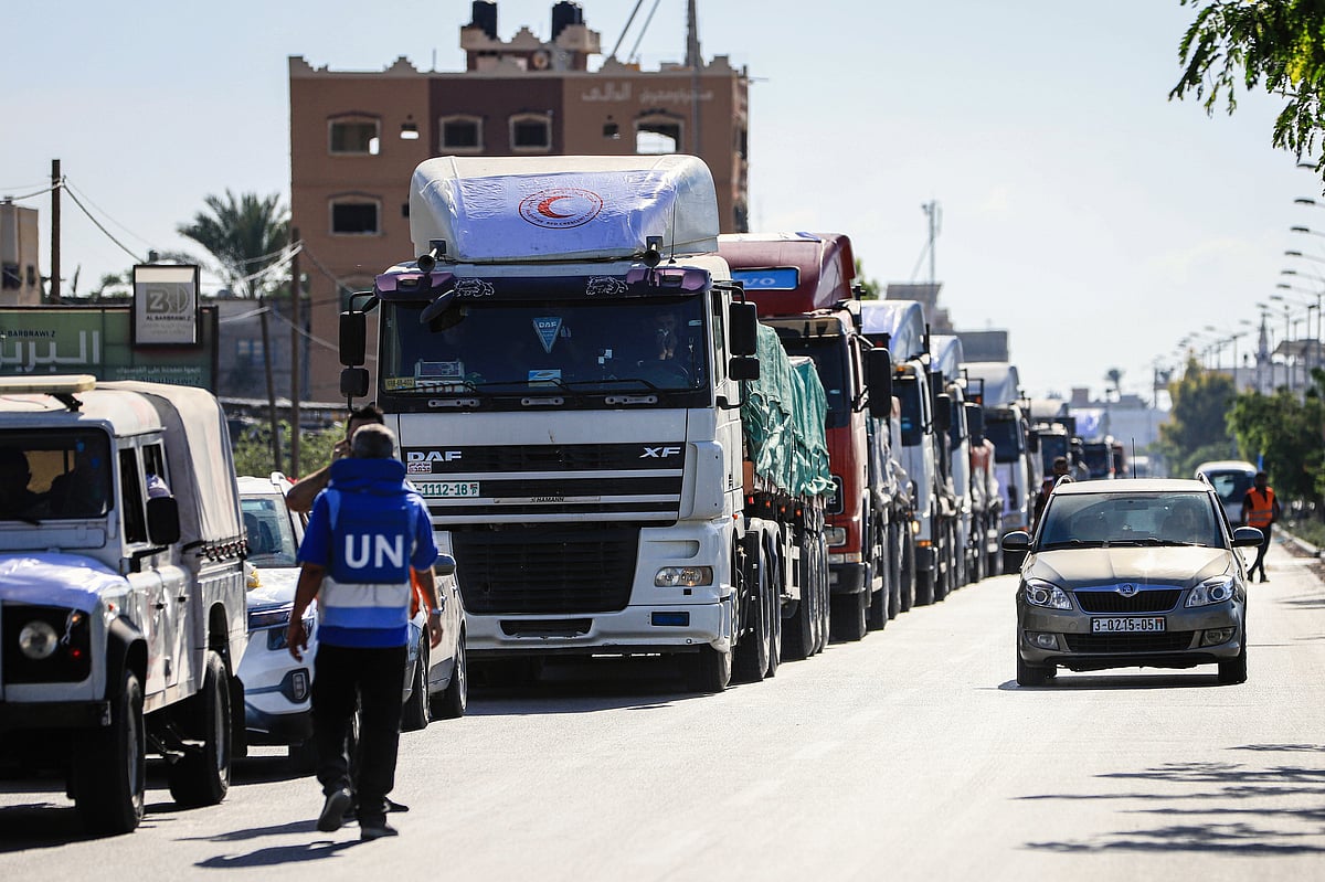 Trucks carrying humanitarian aid head to Deir Al-Balah after crossing from Egypt into the Gaza Strip in Rafah (photo: Getty Images)