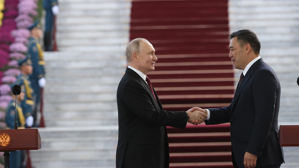 Russian president Vladimir Putin (L) shakes hands with Kyrgyz president Sadyr Japarov (R) during a meeting on 12 October, in Bishkek, Kyrgyzstan. (Photo : Contributor/Getty Images)