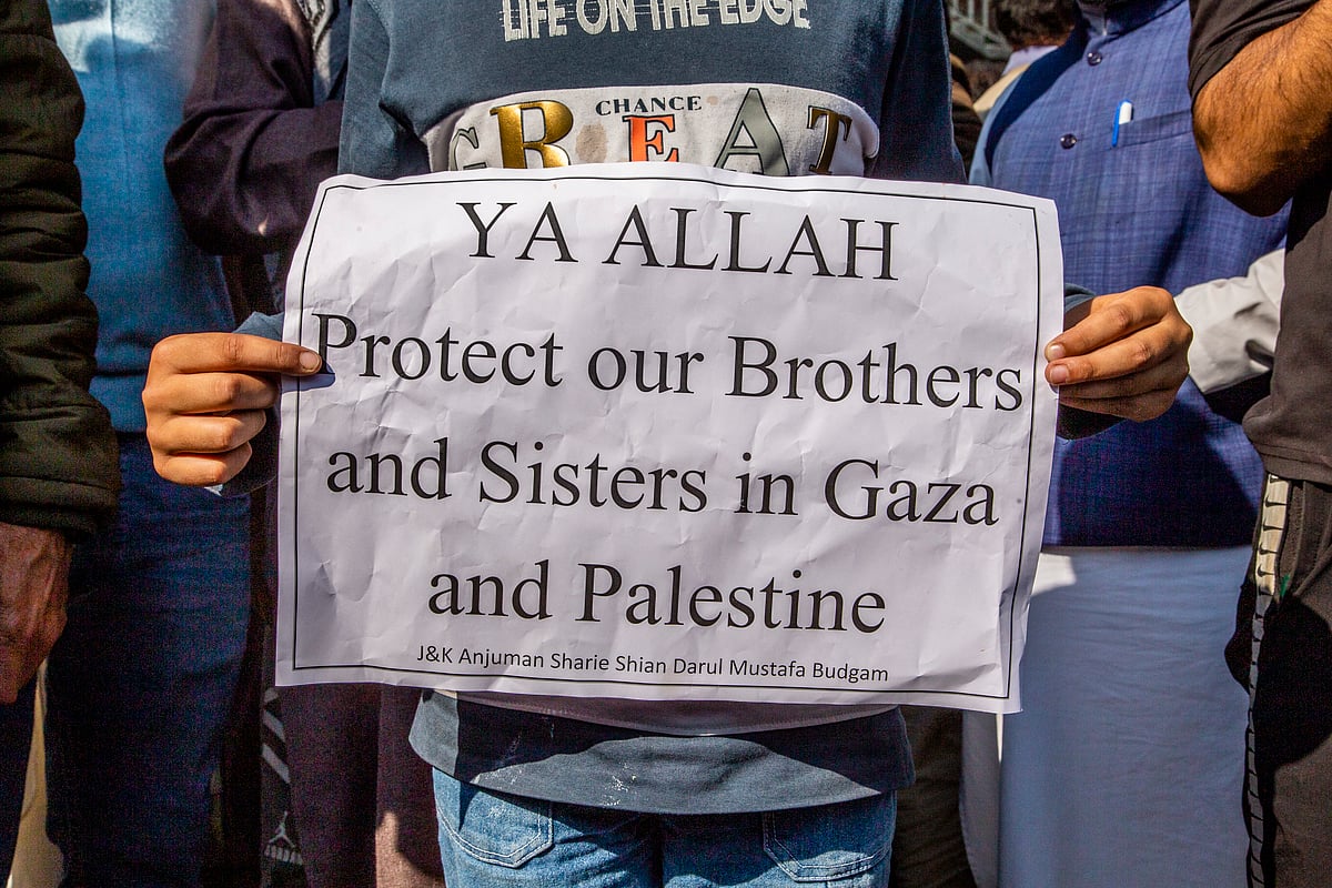 A placard prays for the protection of Palestinians in Gaza, during a protest on October 13 in Budgam, Kashmir (photo: Getty Images)