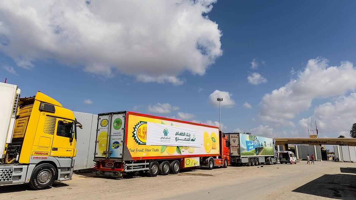 Aid convoy trucks wait at the Rafah border crossing for clearance to enter Gaza (photo: Getty Images)