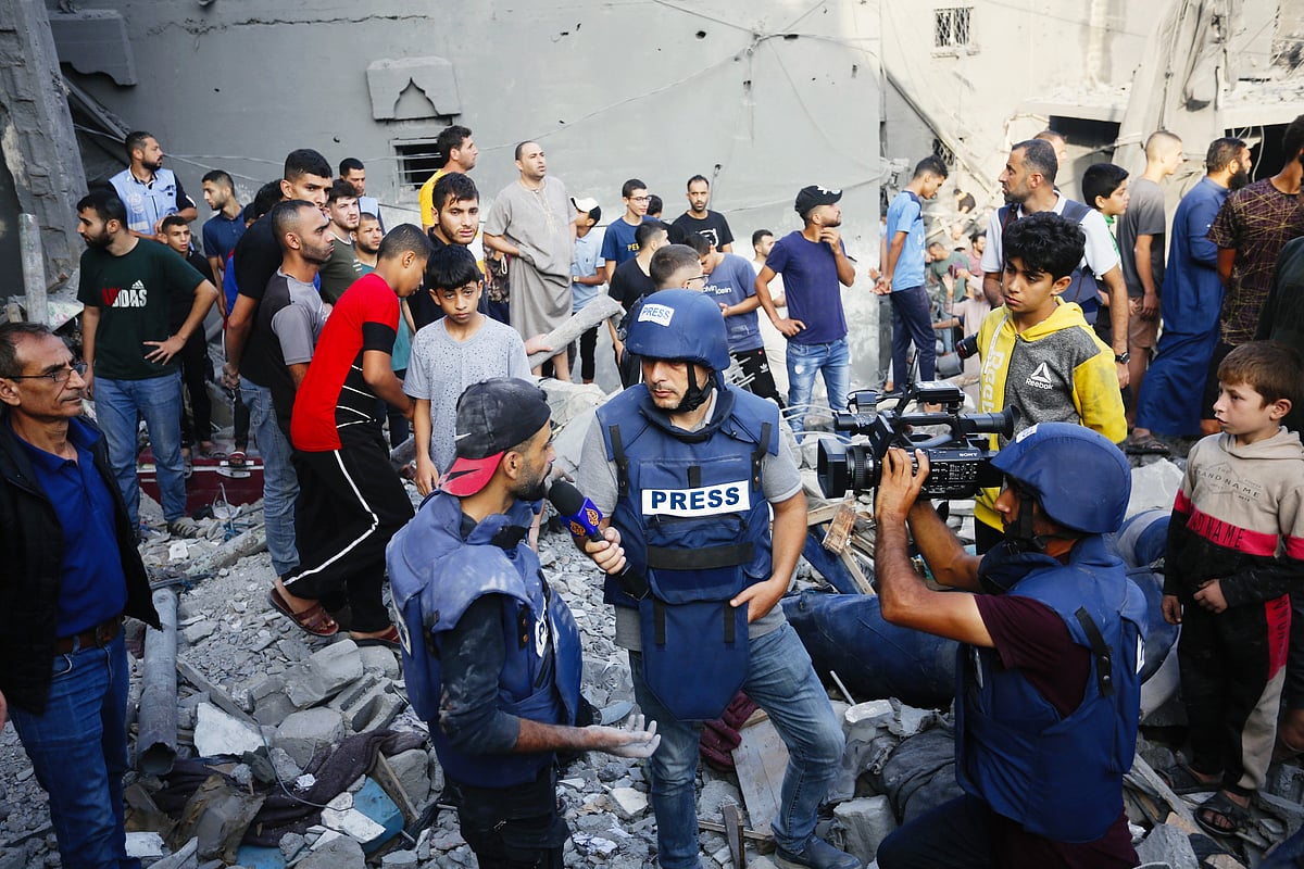 Photo journalist Mohammad Alaloul speaks to media after losing four children and three siblings in an Israeli attack which killed 51 people at Al-Maghazi refugee camp on 5 November (photo: Getty Images)