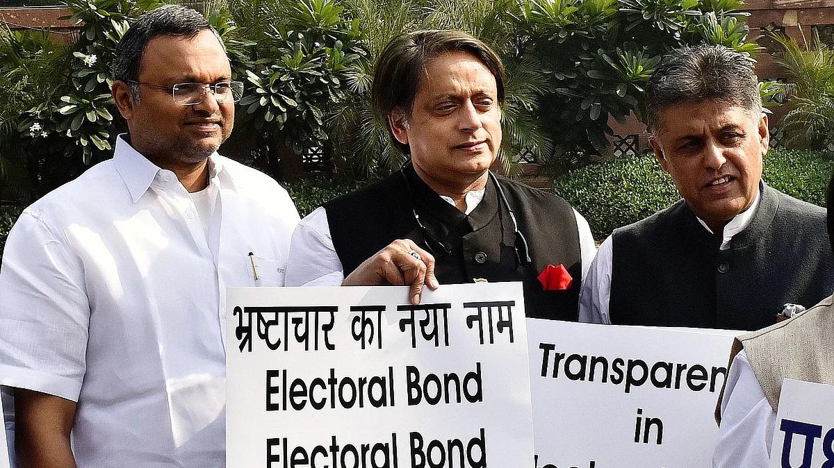 File photo from 2019 of (from left) Congress MPs Karti Chidambaram, Shashi Tharoor and Manish Tewari protesting against electoral bonds in New Delhi