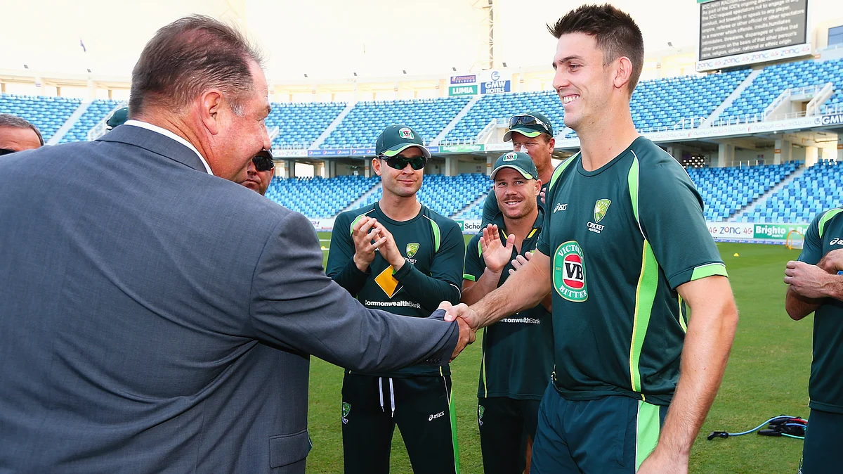 Mitchell Marsh receives his Baggy Green cap from father Geoff Marsh in 2014 (photo: Getty Images)