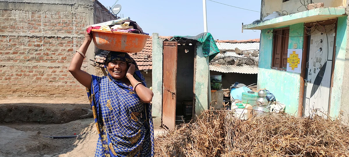 Kamla Bai, a tribal standing outside her home in Govindpura village of Dhar district. (photo: Kashif Kakvi)