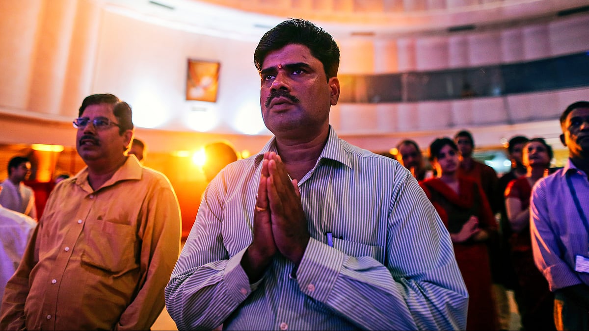 A broker prays before the ceremonial purchase of stocks during muhurat trading at the BSE (photo: Getty Images)