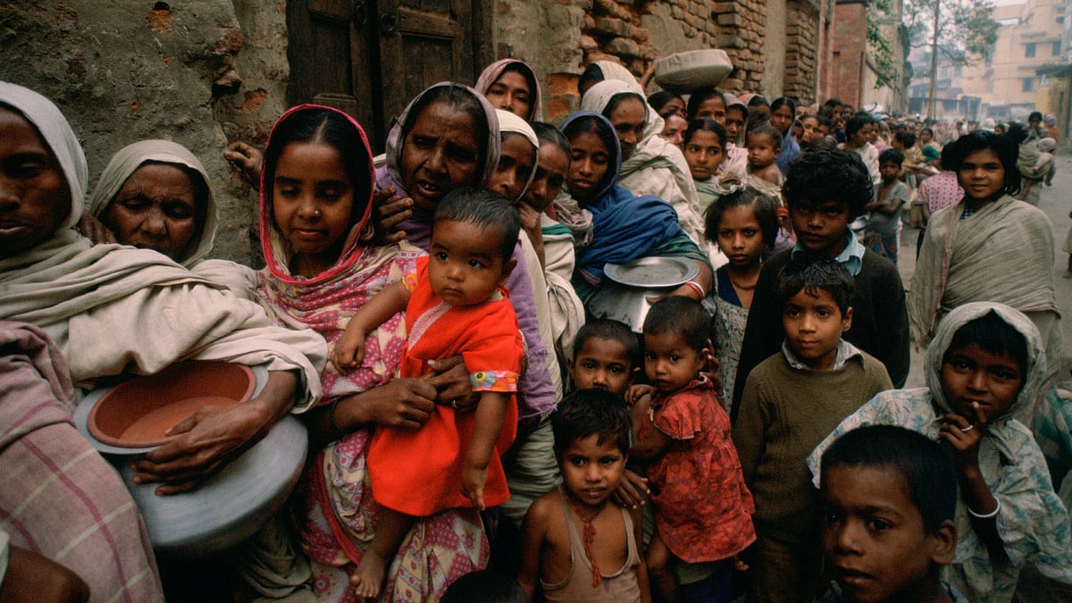 Women and children in an early-morning food queue at Mother Teresa's Mission, Kolkata (photo: Getty Images)