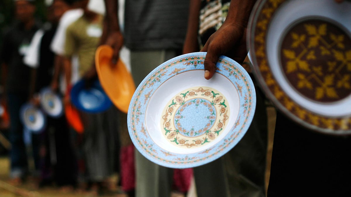 Representative image of people standing in a queue for lunch at a refugee camp (Photo by Ulet Ifansasti/Getty Images)